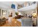Expansive living room featuring an open floor plan, hardwood floors, and staircase at 2595 S Adams St, Denver, CO 80210