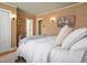 Bedroom showcasing plush bedding, textured walls, and stylish lighting at 1444 Fairfax St, Denver, CO 80220
