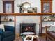 Close-up of the living room fireplace, with decorative mantle and hearth at 1444 Fairfax St, Denver, CO 80220
