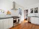 Bright kitchen features white subway tile, stainless steel appliances, and hardwood floors at 1444 Fairfax St, Denver, CO 80220