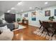 Bright living room with comfortable seating, a dining area, and charming decor at 1444 Fairfax St, Denver, CO 80220