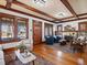 Open-concept living room with hardwood floors and plenty of natural light at 1444 Fairfax St, Denver, CO 80220