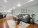 Inviting living room featuring a cozy sofa, stylish decor, and ample natural light at 1444 Fairfax St, Denver, CO 80220