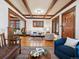 Open-concept living room with hardwood floors and plenty of natural light at 1444 Fairfax St, Denver, CO 80220