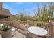 Relax on the outdoor balcony with a white table, chairs and charming flower pots at 2222 N Washington St, Denver, CO 80205