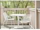 Inviting balcony seating with a white table and chairs, perfect for enjoying the outdoors at 2222 N Washington St, Denver, CO 80205