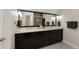 Bathroom with dual sinks, a large mirror, modern vanity, and great lighting at 2222 N Washington St, Denver, CO 80205