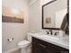 Well-appointed powder room featuring a marble vanity, contemporary fixtures, and stylish decor at 2222 N Washington St, Denver, CO 80205