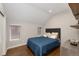 Well lit bedroom with hardwood floors, windows with blinds, and comfortable bedding at 2222 N Washington St, Denver, CO 80205