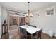 Well-lit dining room with sliding glass doors to a private outdoor patio seating area at 2222 N Washington St, Denver, CO 80205