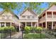 Charming two-story home featuring a lovely balcony, manicured front yard, and classic architectural details at 2222 N Washington St, Denver, CO 80205