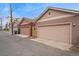 Exterior shot showcasing a row of garages with neutral siding and updated doors, adding to the property's curb appeal at 2222 N Washington St, Denver, CO 80205
