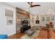 Spacious living room with hardwood floors, modern lighting, and a rustic accent wall at 2222 N Washington St, Denver, CO 80205