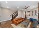 Warm living room showcasing hardwood floors, a staircase, and a glimpse into the kitchen at 2222 N Washington St, Denver, CO 80205