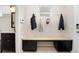Spacious mud room with bench seating, storage cabinets, and coat hooks, perfect for organization at 2222 N Washington St, Denver, CO 80205