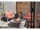 Inviting patio features a stone fire pit surrounded by comfortable seating, perfect for outdoor relaxation and entertaining at 2222 N Washington St, Denver, CO 80205