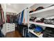Organized walk-in closet with shelving and hanging space, providing ample storage at 2222 N Washington St, Denver, CO 80205