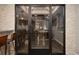 Modern glass wine cellar with ample wine storage at 2222 N Washington St, Denver, CO 80205