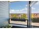 Inviting balcony with flower box overlooking neighborhood with views of the surrounding landscape at 538 S Upham St, Lakewood, CO 80226