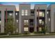 Contemporary condo building with stylish brick and siding, balconies, and well-kept grounds at 538 S Upham St, Lakewood, CO 80226
