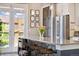 Kitchen island with seating, modern lighting, and stylish accents at 538 S Upham St, Lakewood, CO 80226