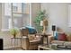 Cozy living room chair with side table, lamp, and decorative accents at 538 S Upham St, Lakewood, CO 80226