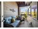 Cozy covered patio with comfortable seating, stylish decor, and a relaxing ambiance at 538 S Upham St, Lakewood, CO 80226
