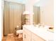 Well-lit bathroom with a clean white vanity, ample storage, and neutral-toned flooring at 121 S Vandriver Way, Aurora, CO 80018