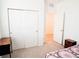 Comfortable bedroom with a spacious closet, featuring contemporary furniture, and plush carpet at 121 S Vandriver Way, Aurora, CO 80018