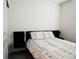 Minimalist bedroom design featuring a contemporary bed frame, stylish linens, and modern decor at 121 S Vandriver Way, Aurora, CO 80018