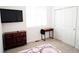 Bright bedroom showcases modern furniture, plush carpet, and an entertainment center at 121 S Vandriver Way, Aurora, CO 80018