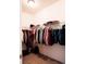 Spacious walk-in closet providing ample storage with organized hanging space and shelves at 121 S Vandriver Way, Aurora, CO 80018
