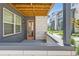 Cozy outdoor balcony area with wood ceiling, brick accents, and neighborhood views at 6791 Navajo Ct, Denver, CO 80221