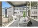 Comfortable outdoor balcony with seating and dark metal railings overlooking the neighborhood at 6791 Navajo Ct, Denver, CO 80221
