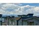 Beautiful view capturing the community's rooftops and distant mountains, all set under a scenic, cloudy sky at 6791 Navajo Ct, Denver, CO 80221