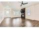 Bright living room featuring a sleek fireplace and ample open space for entertaining at 6791 Navajo Ct, Denver, CO 80221
