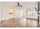 Spacious living area showing hardwood floors and an open layout leading to a staircase at 6791 Navajo Ct, Denver, CO 80221