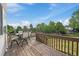 A well-maintained wooden deck features outdoor seating and offers scenic views of the surrounding landscape at 9602 Indian Wells Dr, Lone Tree, CO 80124