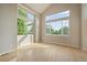 Sun-filled room with vaulted ceiling and large windows, showcasing hardwood floors and inviting ambiance at 9602 Indian Wells Dr, Lone Tree, CO 80124