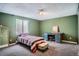 Bedroom features a window for natural light, a stylish desk, and a comfortable bed perfect for relaxation at 1851 S Marshall Cir, Lakewood, CO 80232