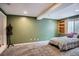 Bedroom with an exposed window with bars, a black mannequin, carpet flooring, and soft, neutral wall color at 1851 S Marshall Cir, Lakewood, CO 80232