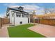 Backyard oasis with artificial grass, patio, pergola and privacy fence at 3800 Umatilla St, Denver, CO 80211