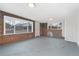 Unfinished basement space with brick accents and natural lighting at 3800 Umatilla St, Denver, CO 80211
