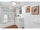 Modern bathroom with glass enclosed shower, vanity and stylish decor at 3800 Umatilla St, Denver, CO 80211