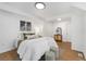 Bright bedroom showcasing natural light, cozy decor, and access to other rooms at 3800 Umatilla St, Denver, CO 80211