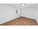 Clean bedroom showcases wood floors, a window, and closet with sliding doors at 3800 Umatilla St, Denver, CO 80211