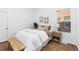 Cozy bedroom featuring natural light and minimalist decor for a relaxing ambiance at 3800 Umatilla St, Denver, CO 80211