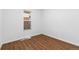 Bright and airy empty room with hardwood floors, ready for customization at 3800 Umatilla St, Denver, CO 80211