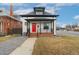 Attractive exterior view of the home featuring a red front door and covered porch at 3800 Umatilla St, Denver, CO 80211