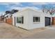 Exterior view of detached garage with brickwork and a private setting at 3800 Umatilla St, Denver, CO 80211